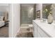 Contemporary bathroom with double sinks, a walk-in shower and access to main bedroom at 5615 Hislop Ln # 82, Mableton, GA 30126