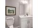 Bathroom with a white vanity, a framed landscape art print, and neutral paint color at 5615 Hislop Ln # 82, Mableton, GA 30126