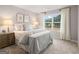 Bedroom with a comfortable bed, lamps, nightstand, and a view at 5615 Hislop Ln # 82, Mableton, GA 30126