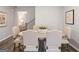 Elegant dining room featuring a rustic table, upholstered chairs, and decorative wall art at 5615 Hislop Ln # 82, Mableton, GA 30126