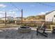 Community fire pit and outdoor seating area on paved patio at 5615 Hislop Ln # 82, Mableton, GA 30126