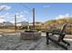 Community fire pit and outdoor seating area on paved patio at 5615 Hislop Ln # 82, Mableton, GA 30126