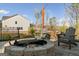 Community fire pit and outdoor seating area on paved patio at 5615 Hislop Ln # 82, Mableton, GA 30126