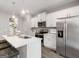 Stylish kitchen with stainless appliances, white cabinetry, a large island, and pendant lighting at 5615 Hislop Ln # 82, Mableton, GA 30126