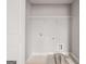Laundry room with hookups and metal rack for functional storage, and a floor sink at 5615 Hislop Ln # 82, Mableton, GA 30126