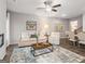 Open-concept living room with a comfortable seating area, fireplace, and view of the dining space at 5615 Hislop Ln # 82, Mableton, GA 30126