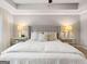 Relaxing primary bedroom with a stylish upholstered bed and soft lighting at 5615 Hislop Ln # 82, Mableton, GA 30126