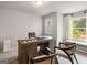 Modern home office with a wooden desk, neutral walls, and bright window views at 5615 Hislop Ln # 82, Mableton, GA 30126