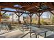 Community outdoor lounge featuring ceiling fans, lighting, and picnic tables at 5615 Hislop Ln # 82, Mableton, GA 30126