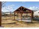 Outdoor lounge with picnic tables, lighting and pavilion in a well-maintained community space at 5615 Hislop Ln # 82, Mableton, GA 30126