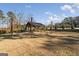 Community outdoor lounge with a cozy pavilion, inviting picnic tables and atmospheric string lights at 5615 Hislop Ln # 82, Mableton, GA 30126