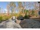 Cozy backyard patio with pavers, fire pit, and outdoor chairs for relaxation at 5615 Hislop Ln # 82, Mableton, GA 30126