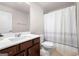 Bathroom with white sink, dark cabinets, and decorative shower curtain with a white door at 774 Belrose Dr, Smyrna, GA 30080