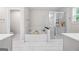 Elegant bathroom featuring a soaking tub, walk-in shower, and tiled floors at 774 Belrose Dr, Smyrna, GA 30080