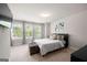 Well-lit bedroom featuring three windows and a woven storage trunk at the foot of the bed at 774 Belrose Dr, Smyrna, GA 30080