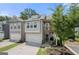 Charming two-story townhome featuring an attached garage and a quaint second story balcony at 774 Belrose Dr, Smyrna, GA 30080