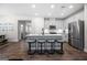 Modern kitchen featuring a large island with seating, stainless steel appliances, and white cabinetry at 774 Belrose Dr, Smyrna, GA 30080