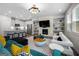 Open-concept living room features a modern fireplace, built-in shelves, and adjoins the kitchen at 774 Belrose Dr, Smyrna, GA 30080