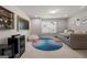Cozy bonus room featuring a gray sofa, TV, bar shelf, bean bag and an area rug at 774 Belrose Dr, Smyrna, GA 30080
