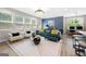 Bright living room with large windows, comfortable seating, and open layout with kitchen and dining at 774 Belrose Dr, Smyrna, GA 30080