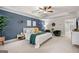 Inviting main bedroom showcasing a tray ceiling, plush carpet, and stylish accent wall at 774 Belrose Dr, Smyrna, GA 30080