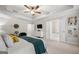 Comfortable main bedroom with a cozy bed, tray ceilings, and a view into the ensuite bathroom at 774 Belrose Dr, Smyrna, GA 30080