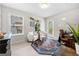 Home office featuring two armchairs, a desk, an area rug and a glass dry erase board at 774 Belrose Dr, Smyrna, GA 30080