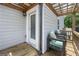 Relaxing patio features two cozy chairs, a pergola, and a door leading inside, creating a welcoming outdoor space at 774 Belrose Dr, Smyrna, GA 30080