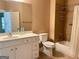 Well-lit bathroom with a white vanity, toilet, and tiled shower/bath combination at 120 Chastain # 1803, Kennesaw, GA 30144