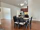 Open dining area with hardwood floors, and view into kitchen at 120 Chastain # 1803, Kennesaw, GA 30144