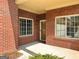 A quaint brick porch is well-lit by natural light through many large windows at 120 Chastain # 1803, Kennesaw, GA 30144