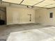 Spacious garage with concrete floors and two entry doors at 120 Chastain # 1803, Kennesaw, GA 30144