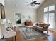 Bright living room featuring vaulted ceilings, windows, and hardwood floors at 120 Chastain # 1803, Kennesaw, GA 30144
