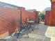 Private brick patio with a bistro set, offering a cozy outdoor space for relaxation or dining at 120 Chastain # 1803, Kennesaw, GA 30144