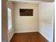 The room is highlighted by warm hardwood flooring and a unique wooden American flag at 120 Chastain # 1803, Kennesaw, GA 30144