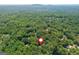 Aerial view of the home's location, surrounded by lush greenery and mature trees at 210 Hunters Vw, Roswell, GA 30075