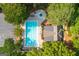 Aerial view of a community pool, clubhouse, and parking lot surrounded by lush trees at 210 Hunters Vw, Roswell, GA 30075