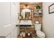 Charming bathroom with rustic wood paneling, a vintage sink, and decorative accents at 210 Hunters Vw, Roswell, GA 30075