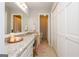 Light and airy bathroom featuring a long granite counter and lots of storage at 210 Hunters Vw, Roswell, GA 30075