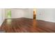 Bonus room with hardwood flooring, natural light, and an open view into a connecting bathroom at 210 Hunters Vw, Roswell, GA 30075