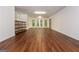 Spacious bonus room with hardwood flooring, natural lighting, and ample space for activities at 210 Hunters Vw, Roswell, GA 30075