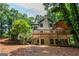 Exterior view of the two-story deck of the house, featuring an outdoor living space at 210 Hunters Vw, Roswell, GA 30075