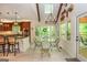 Sunny dining area with views of the surrounding landscape and access to the outdoors at 210 Hunters Vw, Roswell, GA 30075