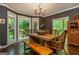 Dining room features a rustic wooden table with bench seating and bright natural light at 210 Hunters Vw, Roswell, GA 30075