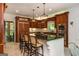 Spacious kitchen with dark wood cabinets, granite countertops, and modern appliances at 210 Hunters Vw, Roswell, GA 30075