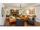 Inviting living room with stone fireplace, hardwood floors, and comfortable seating at 210 Hunters Vw, Roswell, GA 30075
