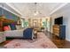 Spacious main bedroom with a king-size bed and sitting area at 210 Hunters Vw, Roswell, GA 30075