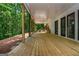 Outdoor porch with wooden flooring and pillars, offering a serene view of the surrounding forest at 210 Hunters Vw, Roswell, GA 30075