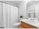Clean bathroom with shower and tub, white vanity, and a soft, white color palette at 3 Maplelake Dr, Acworth, GA 30101