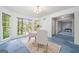 Bright dining room featuring a large window, chandelier, and hardwood floors at 3 Maplelake Dr, Acworth, GA 30101